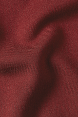 Nahaufnahme eines Crepe-Jersey Stoffes in rostrot