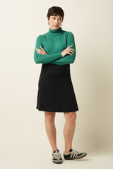 getragener Jupe Rock Border Skirt Milano Uni Black mit grünem Pullover von King Louie im Youmee.market Bern