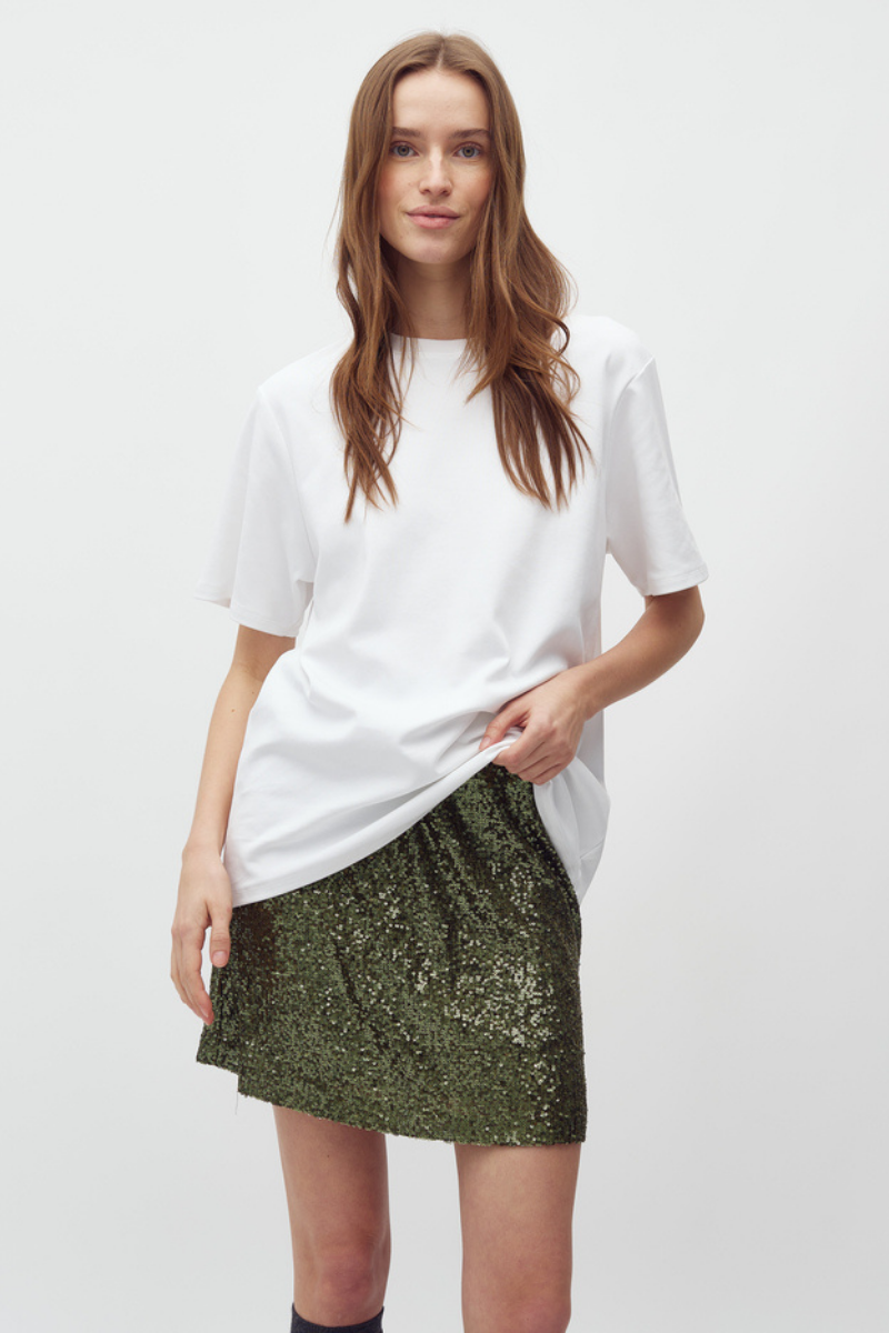 Pailletten Mini-Rock jupe getragen von Frau in grün im youmee.market in Bern 